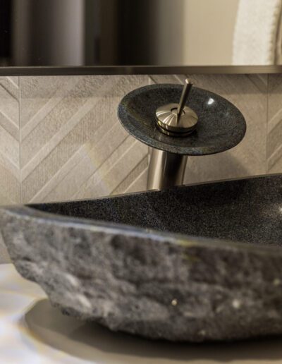 A stone sink in a bathroom.