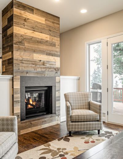 A living room with a wood burning fireplace.