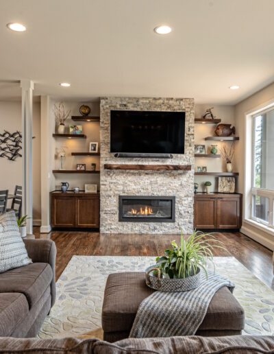 A living room with a fireplace and tv.