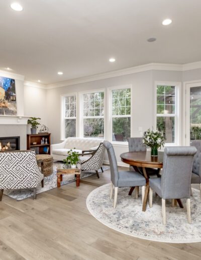 A living room with hardwood floors and a fireplace.