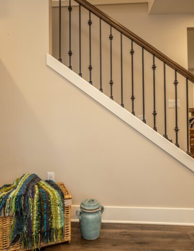 A wicker basket on a wooden floor.