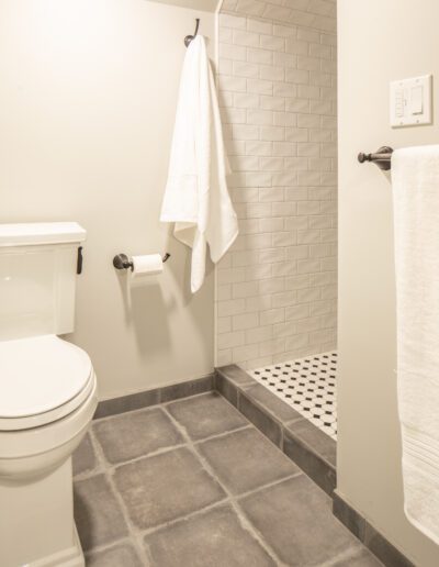 A white toilet in a bathroom.