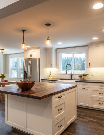 A kitchen with hardwood floors and a center island.