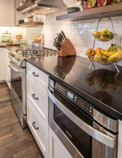 A kitchen with a stainless steel stove and oven.