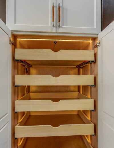 A kitchen with a lot of drawers in it.