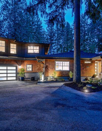 A home in the woods at night.